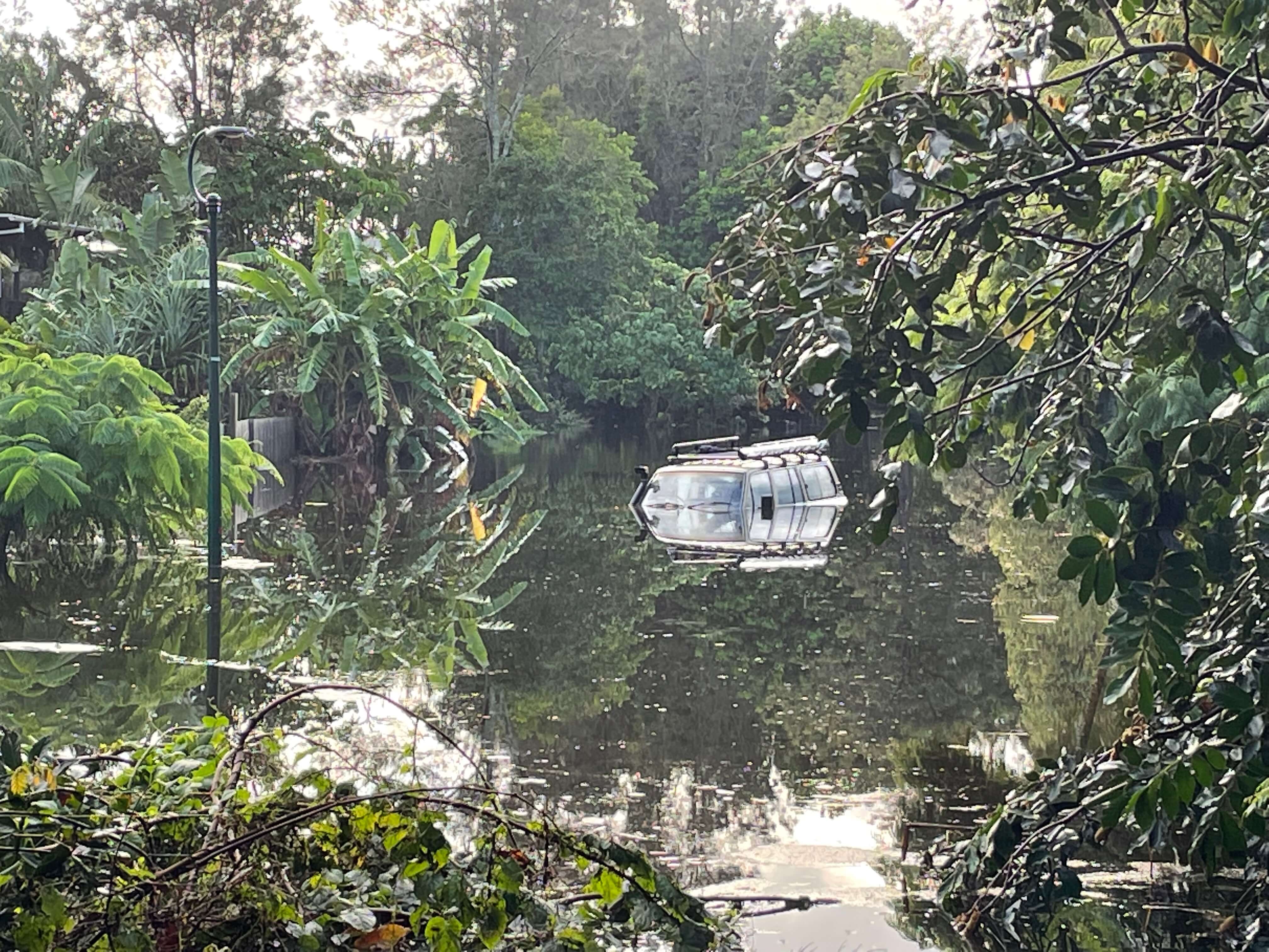 A Land Cruiser submerged in flood water